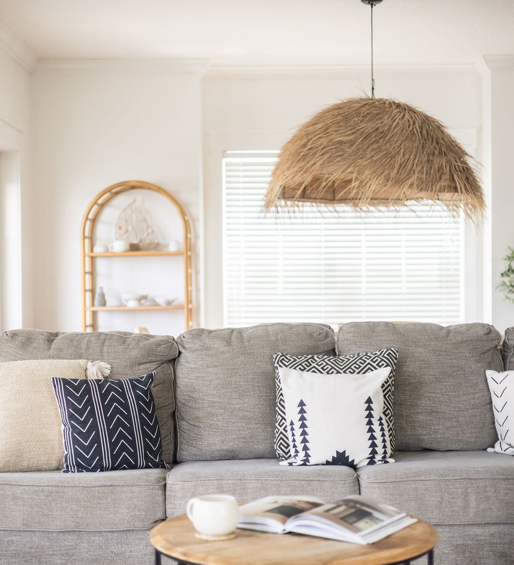 Bright living room cleaned and prepared for guest arrival